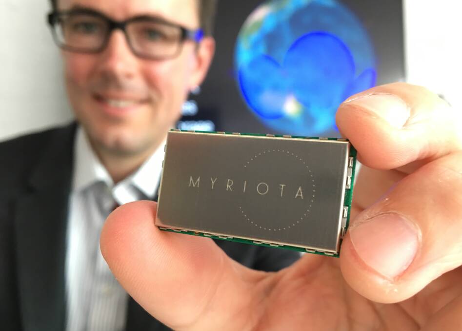 Myriota chief executive officer, Dr Alex Grant, holds one of the new technology company's low cost satellite transmitters.