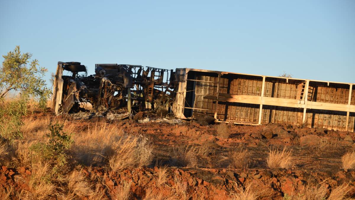 AFTERMATH: The burnt cattle train on the Barkly Highway on Friday morning. Photo: Derek Barry. 