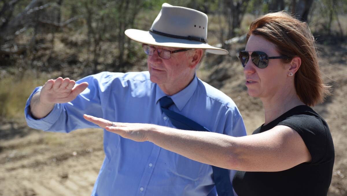 Senator Ian Macdonald examines the Flinders River with McKinlay Shire mayor Belinda Murphy on Friday. Photo: Chris Burns. 