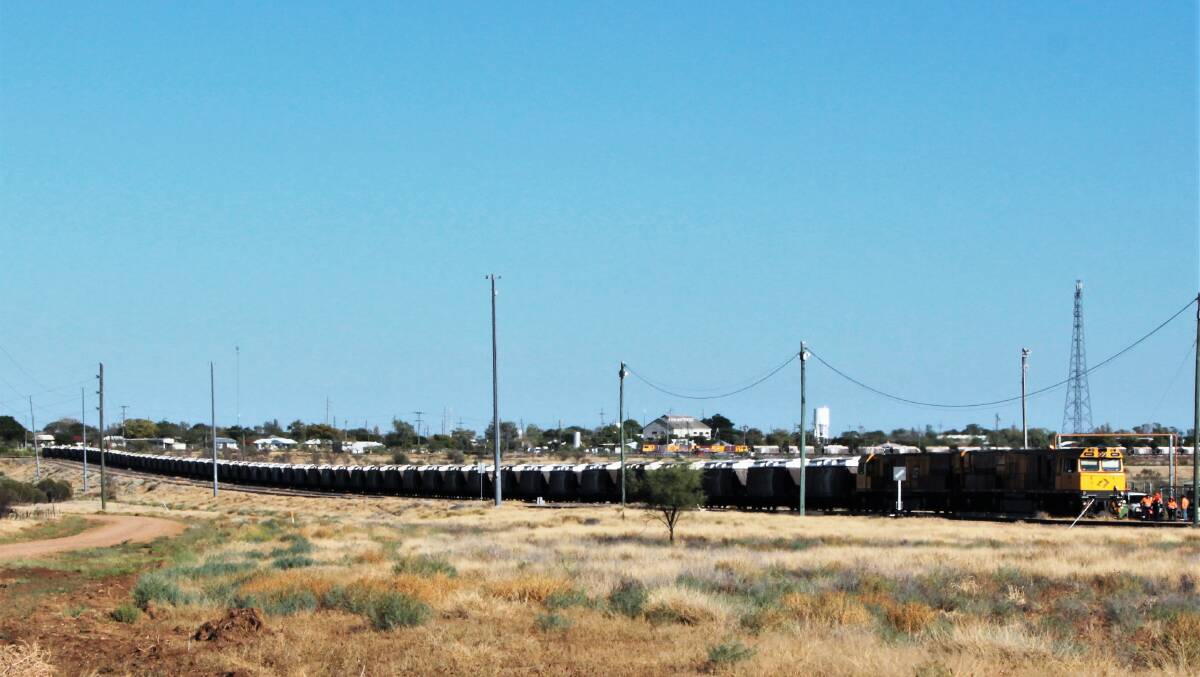 An Aurizon train on the outskirts of Hughenden. The community had been affected by job losses last year. Photo: Sally Cripps. 