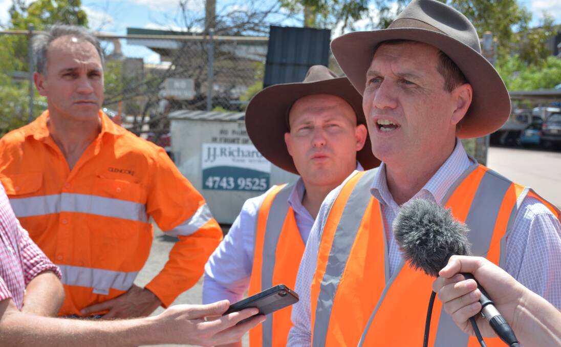 Minister for State Development, and Natural Resources and Mines Anthony Lynham speaks of the funding announcement as Glencore's Mike Westerman and treasurer Curtis Pitt listens. Photo: Chris Burns. 