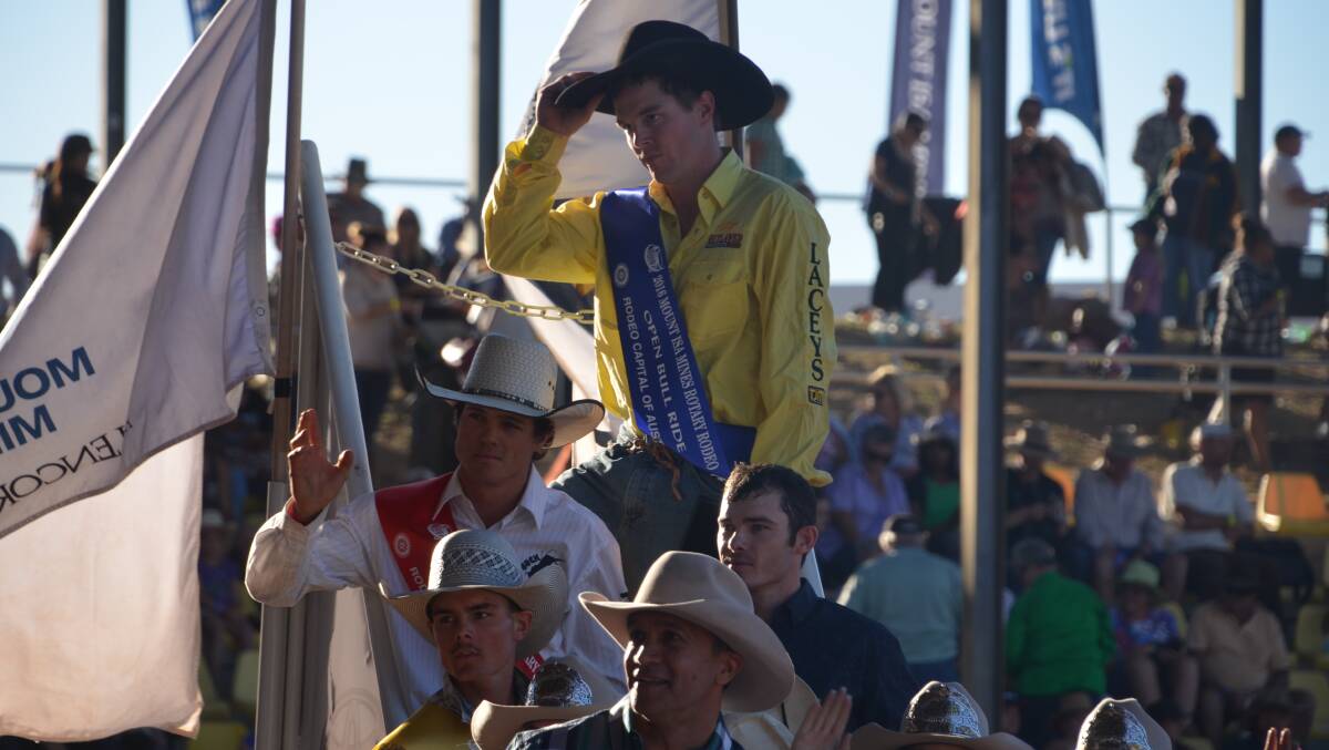 VICTORY LAP: Jared Borghero stands tall after winning the bull ride at the 2016 Mount Isa Rotary Rodeo. Photo: Derek Barry. 