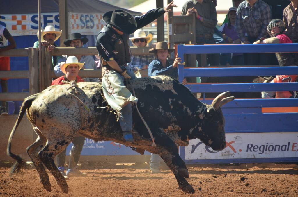 Jared Borghero rides in the 2016 Mount Isa Rotary Rodeo. Photo: Derek Barry. 