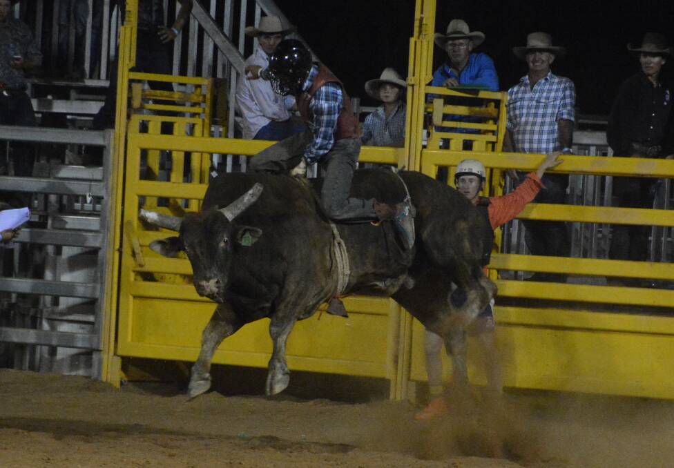 Donovan Rutherfurd rides his bull in the final, but is about to have his hand caught in the rope.