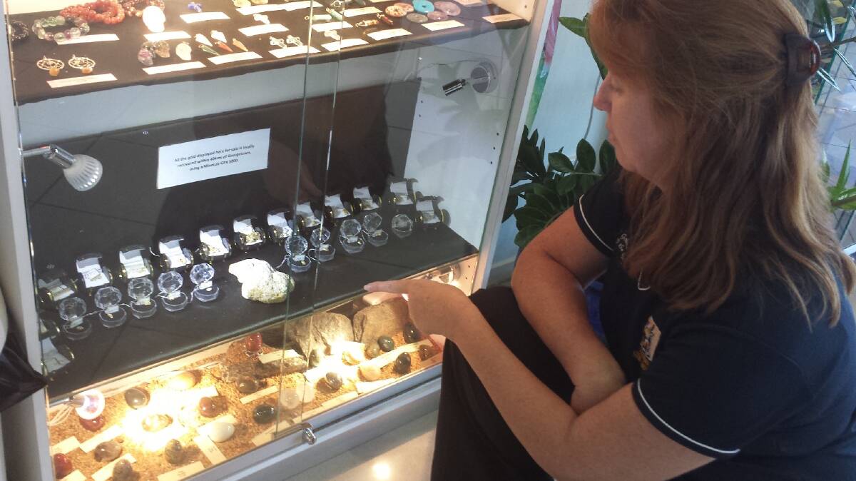 TerrEstrial Visitor Information Centre manager Tasmin Alderton with a display of gold nuggets.