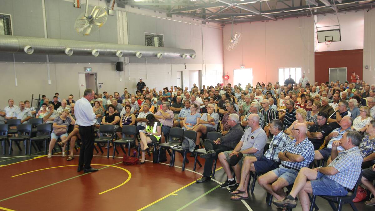 Affected Ingham canegrowers listen to Deputy Prime Minister Barnaby at a meeting in February to resolve the long-running dispute between Wilmar and QSL.
