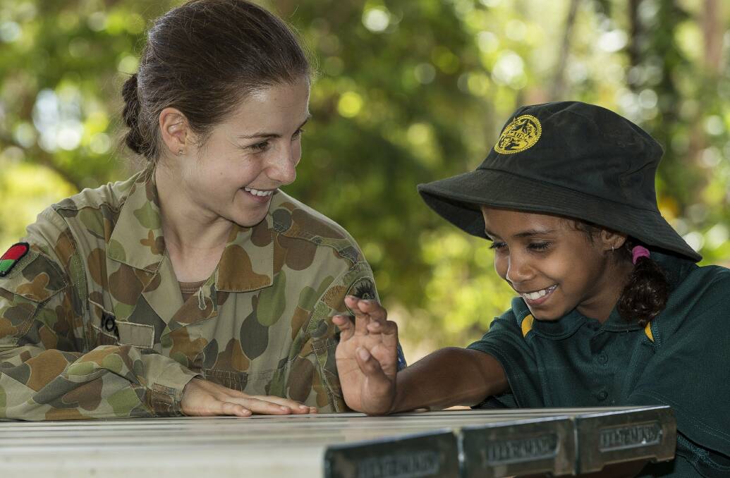 Australian Army officer Lieutenant Stephanie Costa shares a laugh with Laura State School student Montana Rowland during a visit to the school.