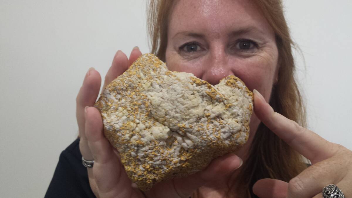 Tasmin Alderson, manager of Georgetown's TerrEstrial Visitor Information Centre, with a 1.4kg gold nugget on sale at the centre. 
