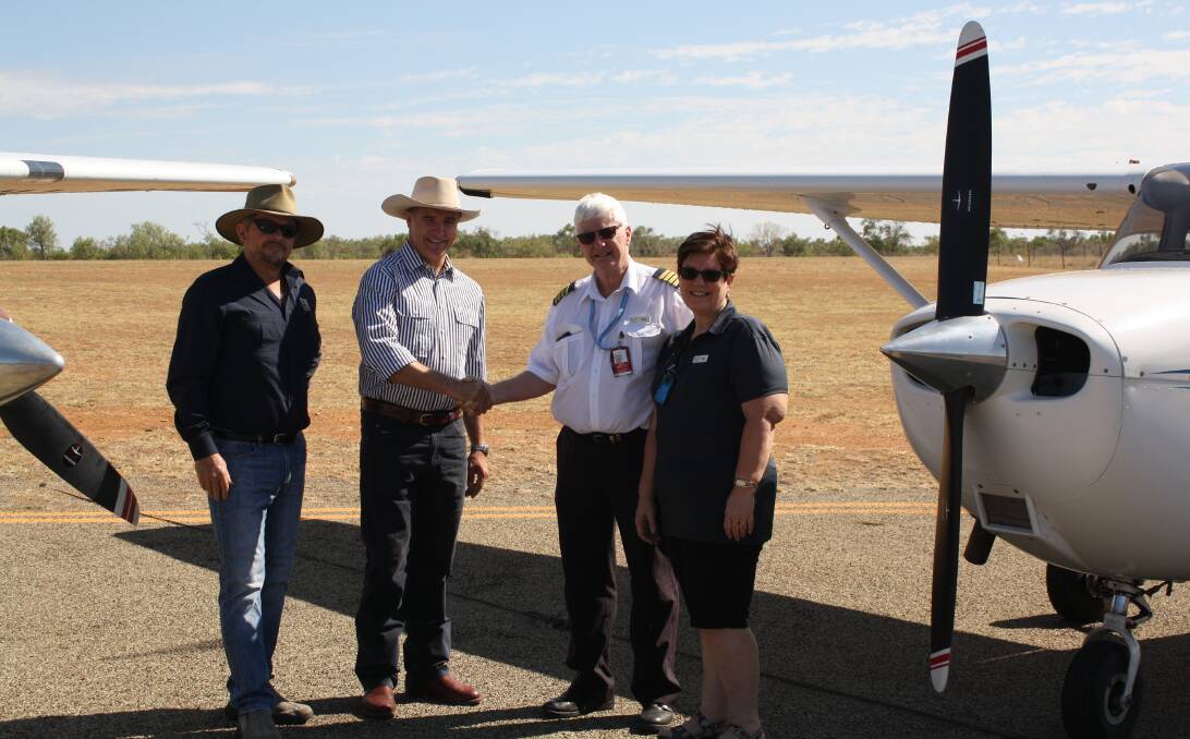 Etheridge Mayor Warren Devlin, Member for Mt Isa Rob Katter and Aviation College owners Tony and Deb Beauchamp, celebrate the establishment of a new aviation hub in   Georgetown.