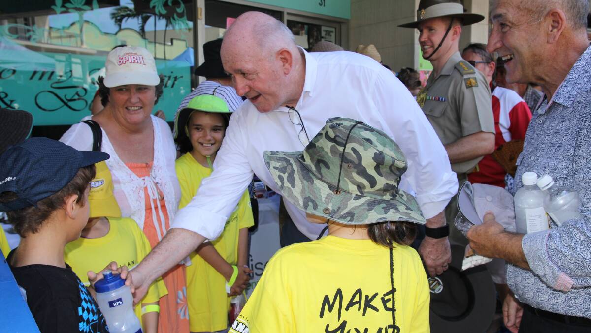 Governor General Sir Peter Cosgrove meets local children at the Feast of the Senses in Innisfail.