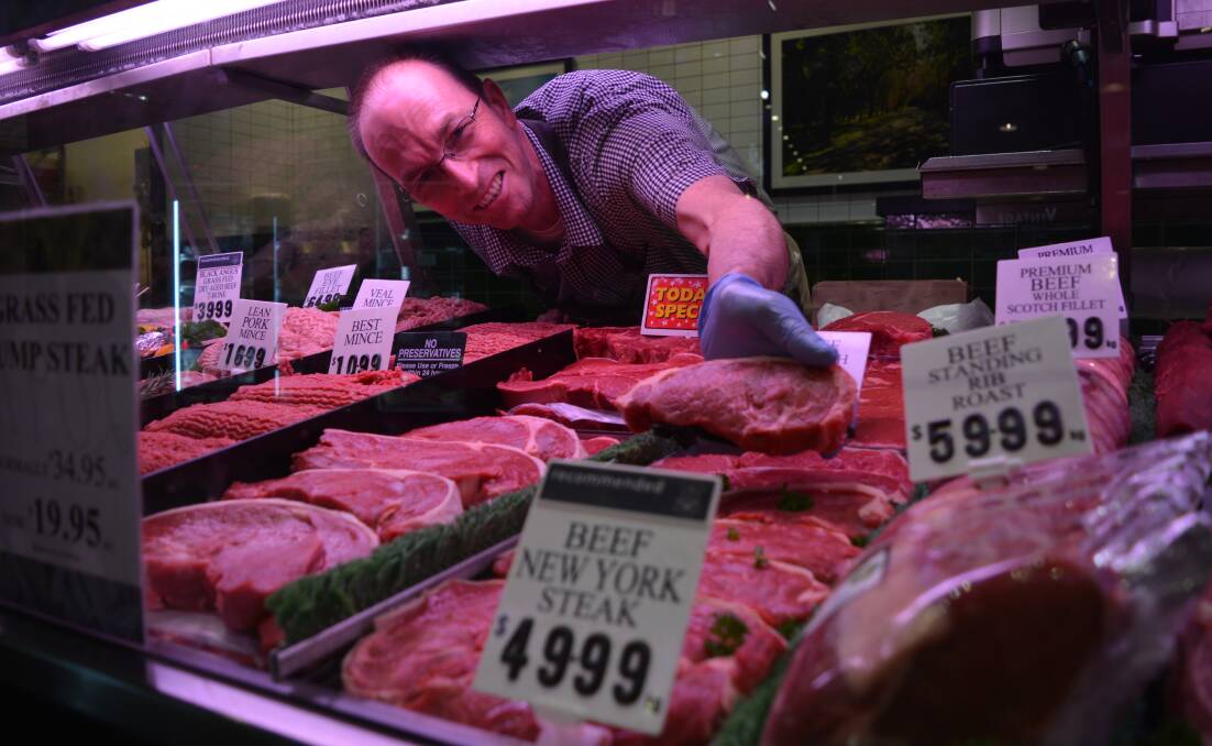 Manager of Craig Cook's retail outlet The Natural Butcher at Bondi Junction, Sydney, Sam Charles at work.