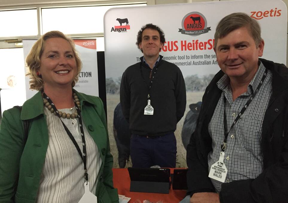 Mandy and Mark Wales, Alloura Angus at Yass ,chat with Lachlan Ayouh, Zoetis at Tamworth, this morning at the trade display session of the Angus National Conference in Ballarat.