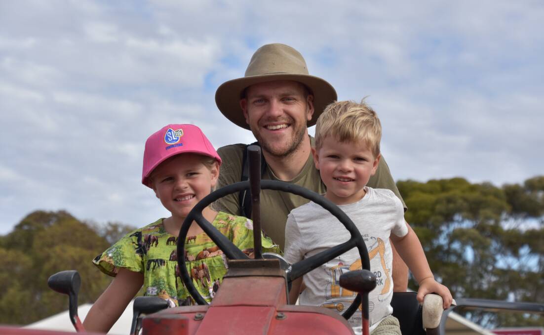 Mary, John and Sam McPherson of west Gippsland explore the range of vintage machinery at the field days. Photo by Gregor Heard. 