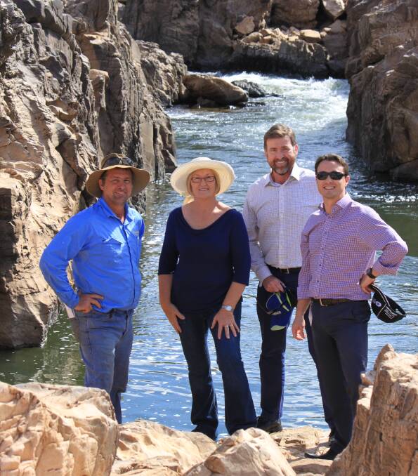 Landholder Michael Penna, Charters Towers Regional Council Mayor Liz Schmidt, Craig Wilson from the Premiers Department and the Deptartment of State Development's Matt Morris inspecting the Big Rocks Weir project location.