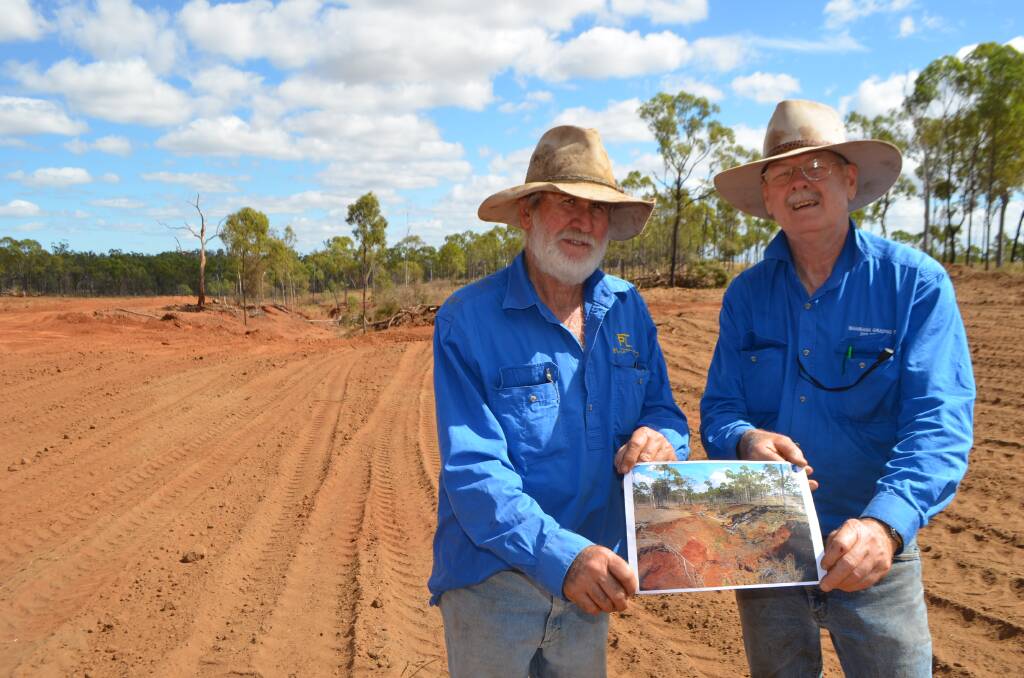 Beef producer David Nicholas, Payne's Lagoon and DAF principal extension officer Bob Shepherd display a photo of what the gully looked like before work started on Saturday compared to now.