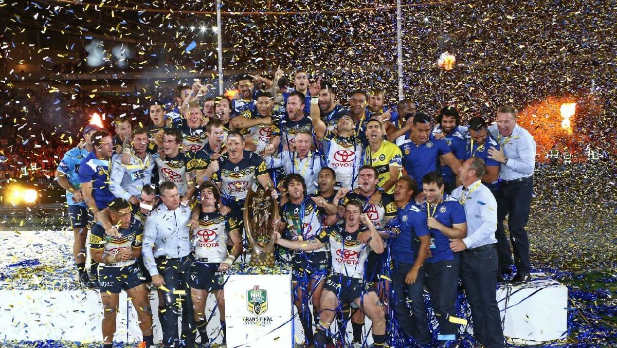 The North Queensland Cowboys celebrate after their 17-16 golden point victory over the Brisbane Broncos last night.