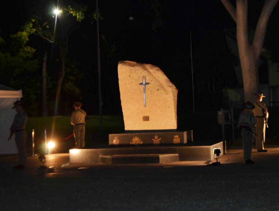 The catalfaque party guard the Thuringowa Central Cenotaph during the Anzac Day Dawn Service held in Townsville on Tuesday morning.