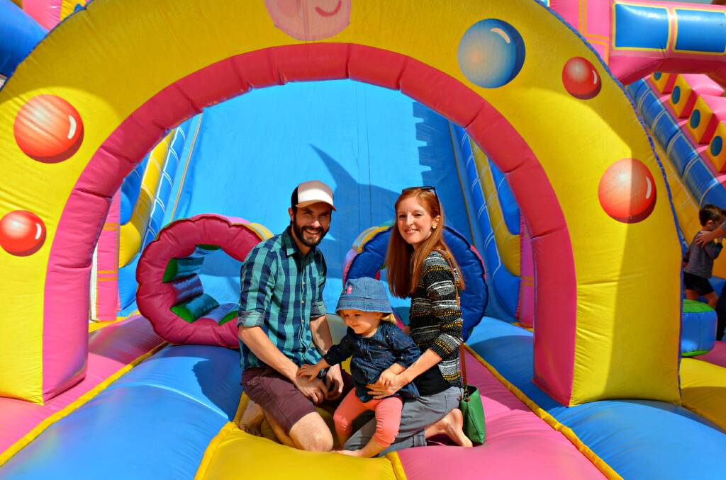 Bounce to the Burdekin: Ayr's Nick and Suzy Loader got into the show spirit with daughter Tilly, enjoying a go on one of the many rides and attractions available.