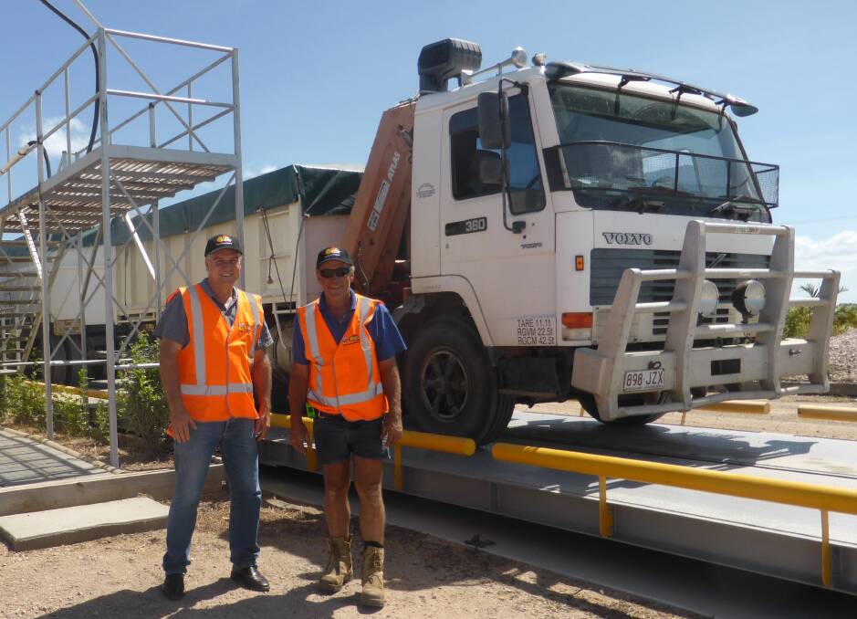 SunRice North Queensland's Rob Eccles welcomes Giru rice grower Robert Stockham with the first truck of the 2015 dry season rice for unloading at the SunRice Brandon Mill.
