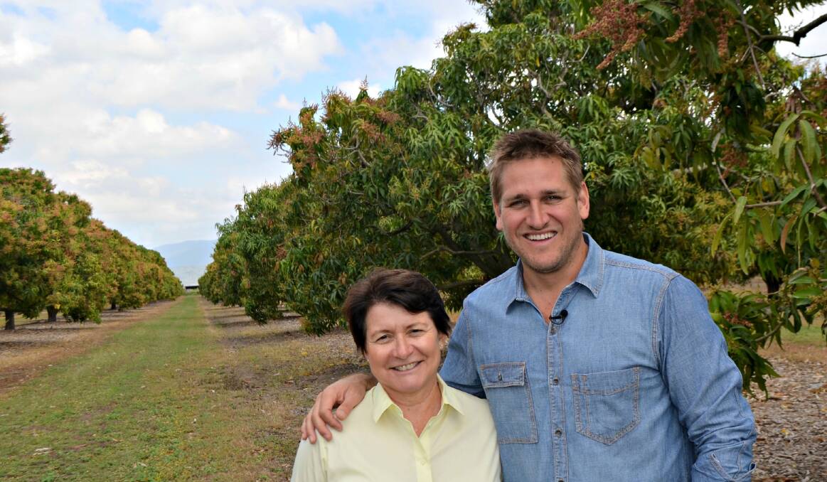 Manbulloo Mangoes managing director Marie Piccone with Coles Fresh Advisor and chef Curtis Stone at the 18,000 tree plantation located at Horseshoe Lagoon in Giru.