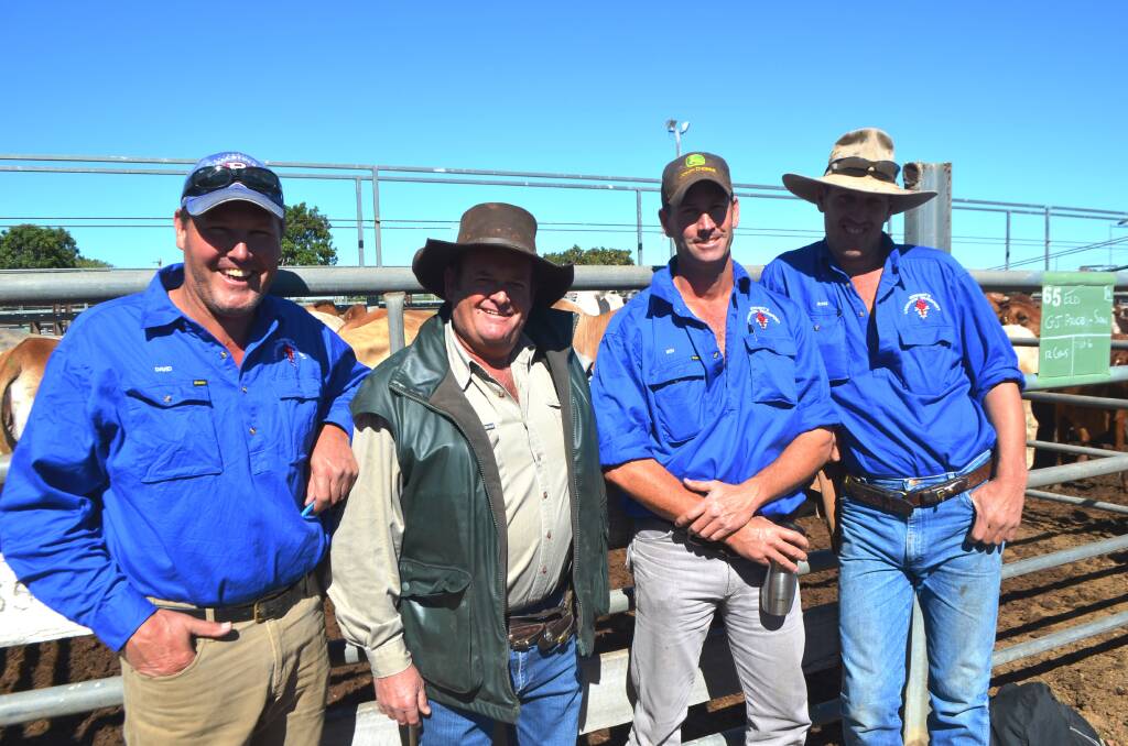 The Schmidt's Livestock Transport team of David Elmes, Ben Winters and Ross Sanderson having a yarn with beef producer Elton Callcott (second from left), Ellenvale, Charters Towers at the sale.