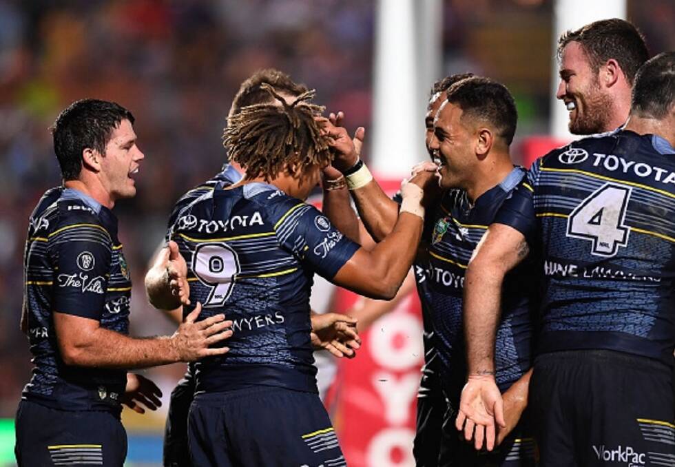 Winning form rekindled: The North Queensland Cowboys celebrate after their 34-6 dismantling of the New Zealnd Warriors at 1300SMILES Stadium in Townsville on Saturday night.