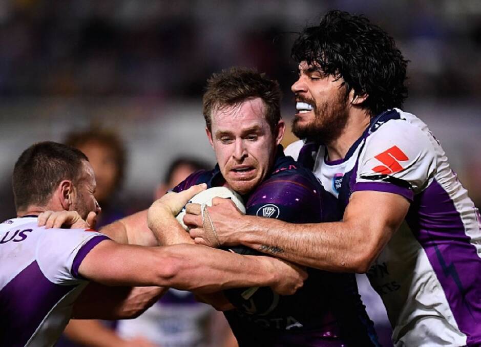 Stifled: The Melbourne Storm defence was on-point during their 16-8 victory against North Queensland Cowboys in Townsville on Saturday night.