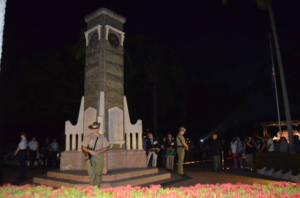 The Catalfaque Party stand watch at the ANZAC Park Cenotaph during the ANZAC Day Dawn Service, The Strand, Townsville.
