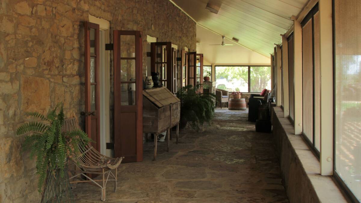 Cool customer: Giant river stones and a gauzed verandah make for the perfect living conditions inside the Darr River homestead. Pictures: Sally Cripps.