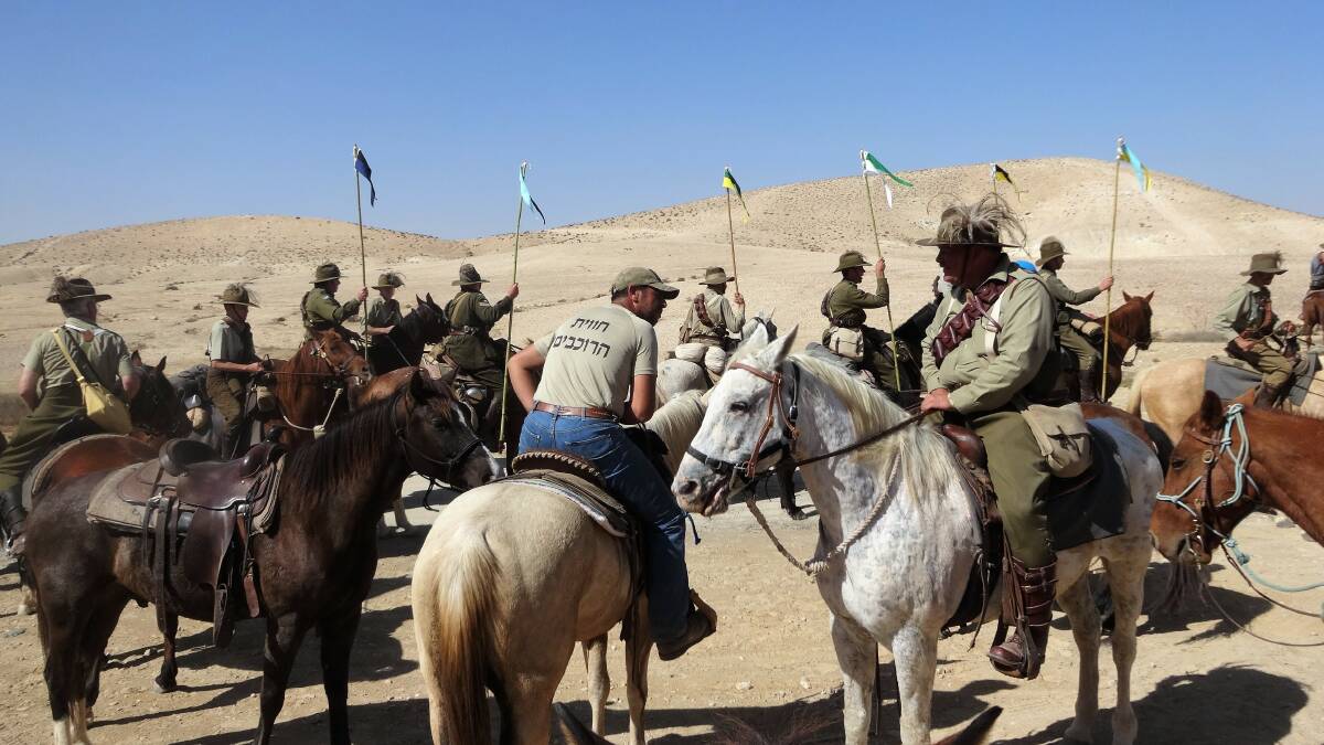 The Negev Desert troop prepares to mount a march past for the Australian Army colour party bearing the 4th and 12th Light Horse colours.