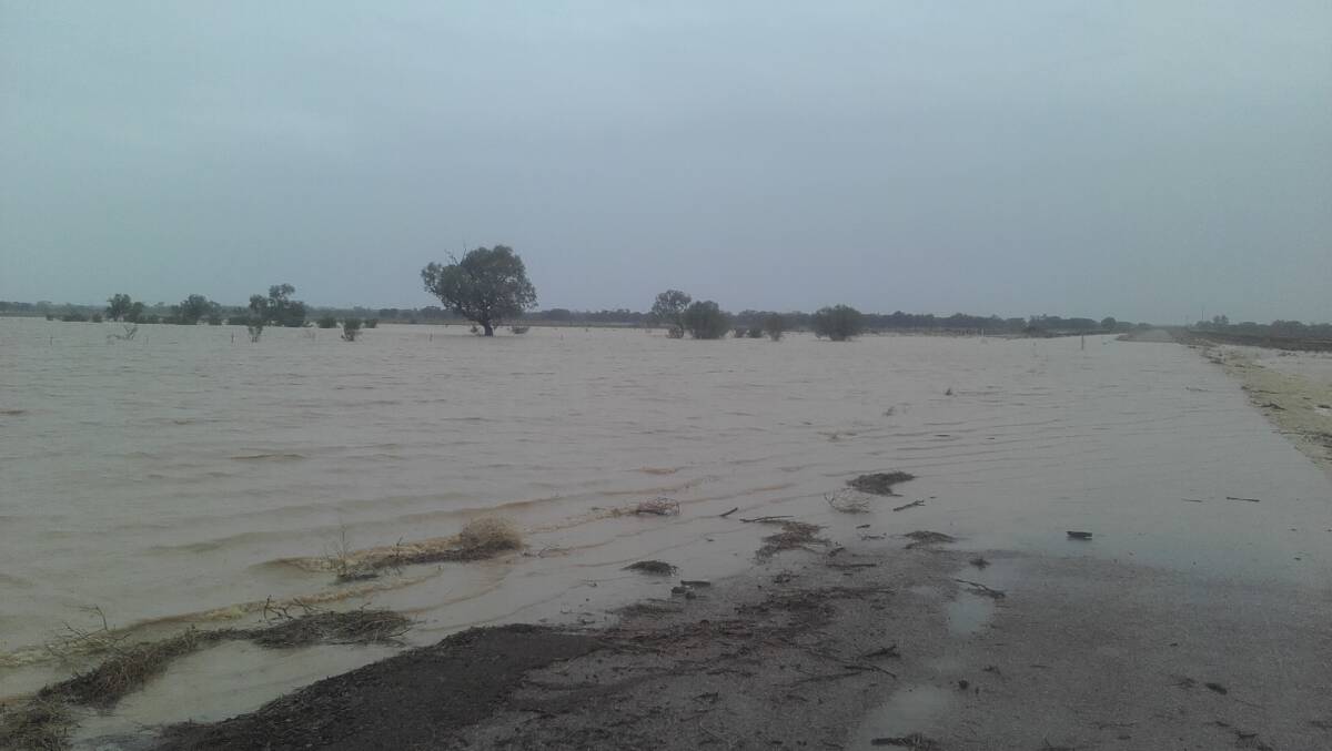 Full to capacity: Sections of the Landsborough Highway, such as this causeway at Collumpton Creek east of Ilfracombe, have been closed in the wake of the rain in the central west. Photo: Lindsay Warren.