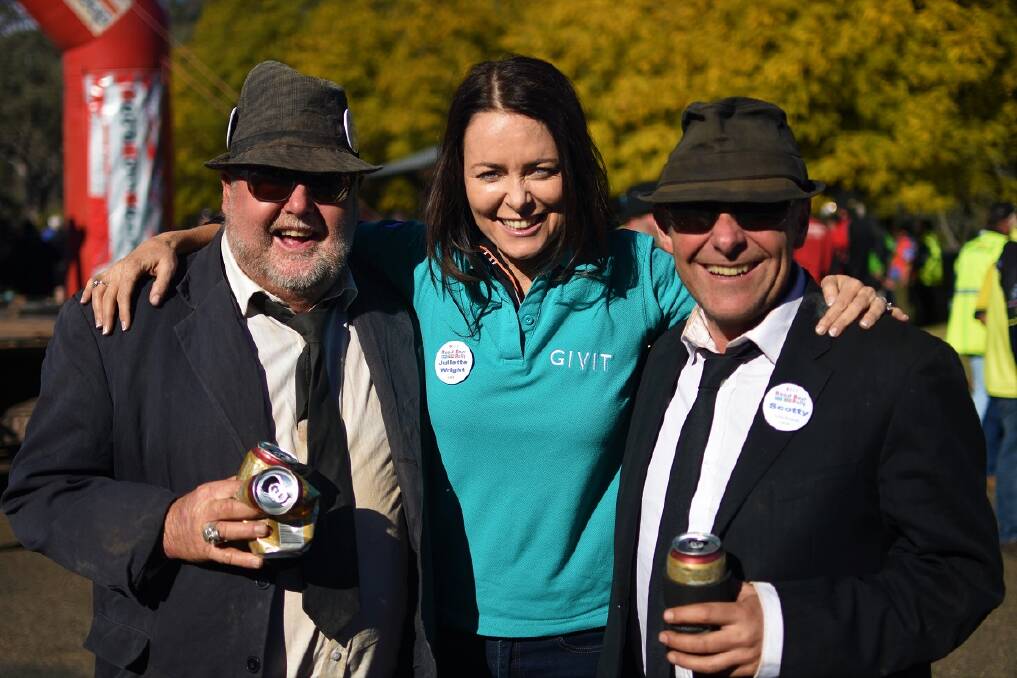 GIVIT founder Juliette Wright hugs Road Boss rally winners, the Booze Brothers.