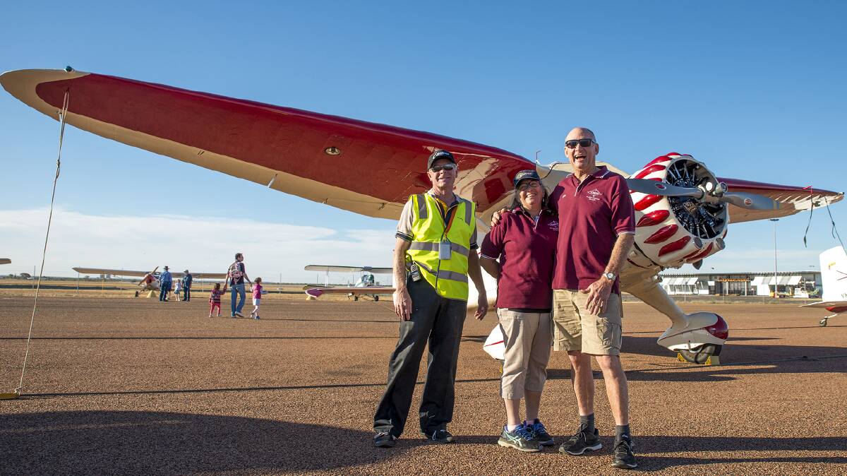Longreach airport manager, Anthony 'Shorty' Daniels, with Vicki and Kevin Bailey, the owners of the aircraft pictured. Photo supplied by QAL.