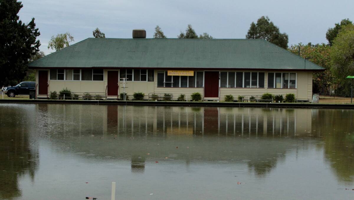 Wet wonder: Barcaldine's bowling green was better suited for duck diving on Sunday morning, after 105mm of rain was recorded overnight. Photo: Sally Cripps.