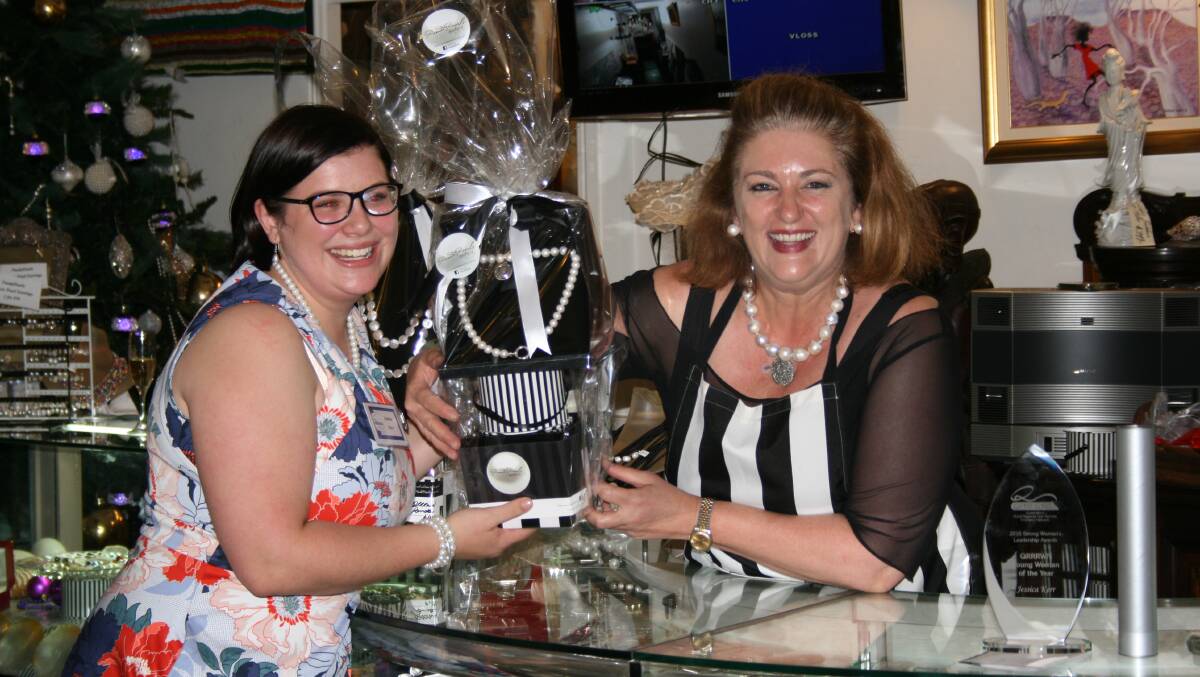 Young Rural Woman of the Year, Jess Kerr receiving her prize from Amanda Stein, Panda Pearls.