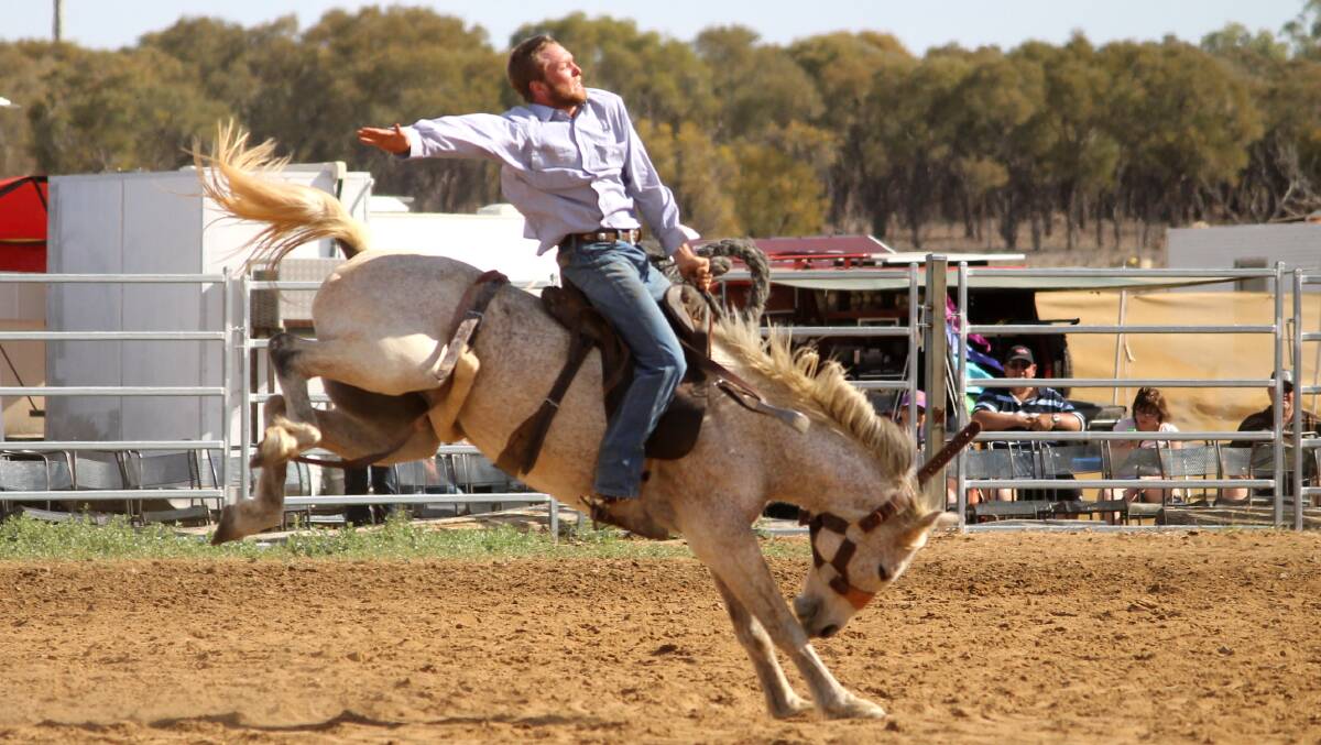 Blackall's Jack Campbell competing in the 2014 station buckjump.