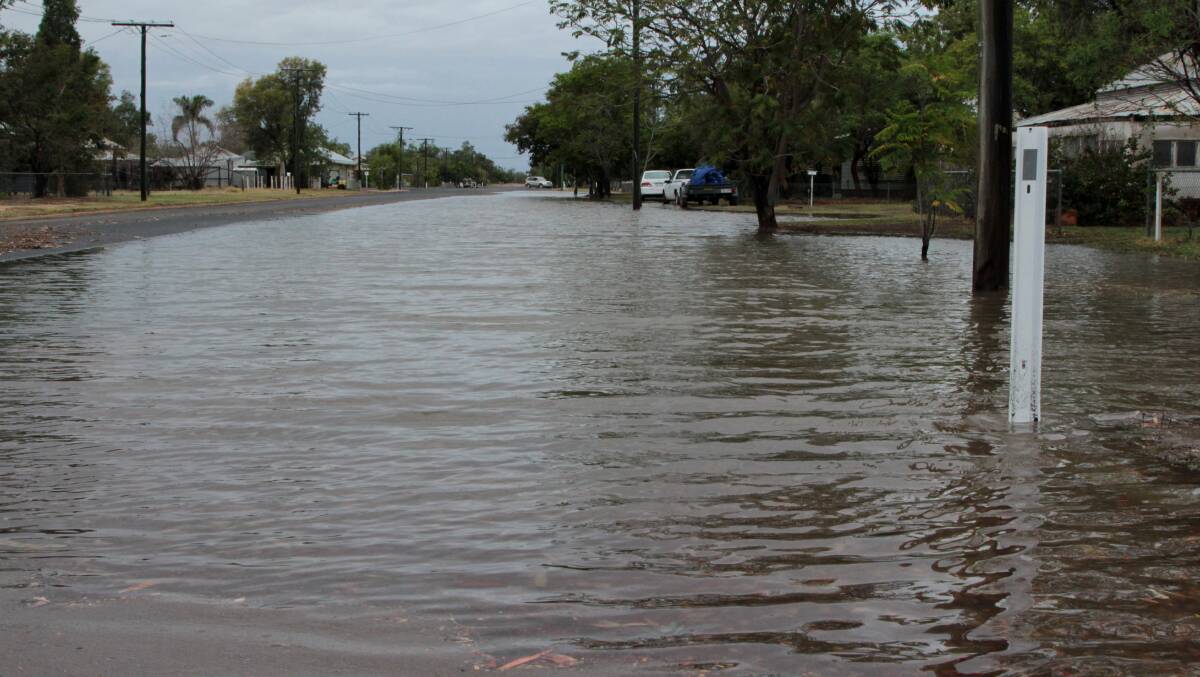Awash: Water lying in the streets of Barcaldine on Sunday morning. Photo: Sally Cripps.