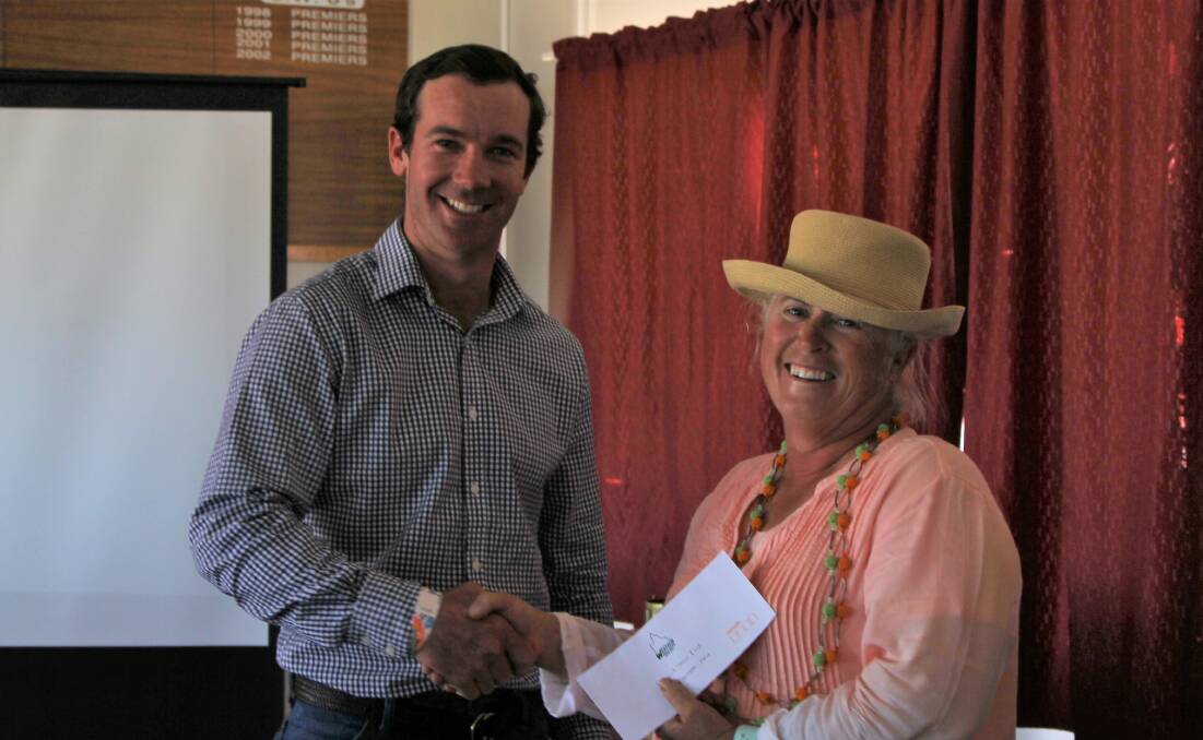 Westech steer trial convenor, Tom Chandler, congratulates Robyn Adams for her win in the grassfed section.