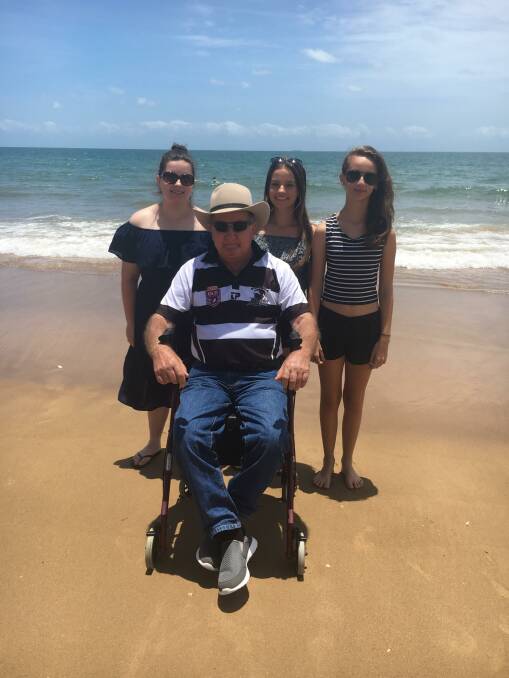 Staunch Blackall Magpies rugby league supporter, Bill Richardson, pictured with three of his grandaughters, Jocelyn, Laine and Ella Fletcher, at Tannum Sands, is getting ready to relive his Olympic torch run in his hometown next Friday, carrying the Queen's Baton in the Commonwealth Games relay.