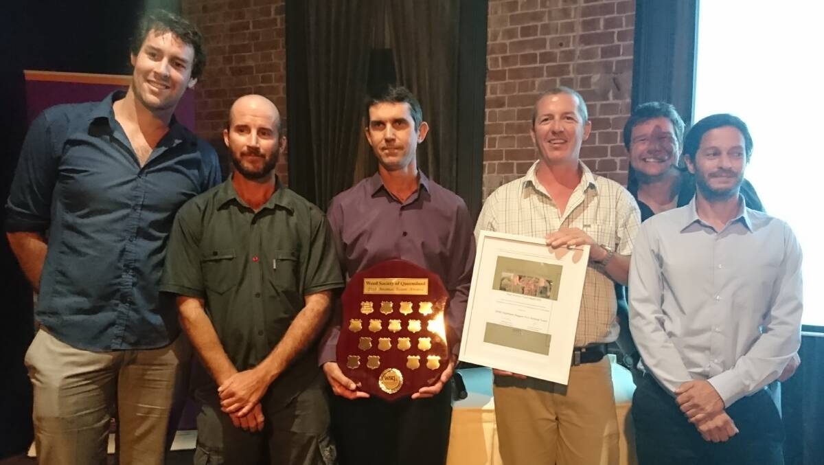 Colin Dollery accepted the team award for pest animal management from Weed Society of Queensland president Ian Jamieson, along with members of the team.