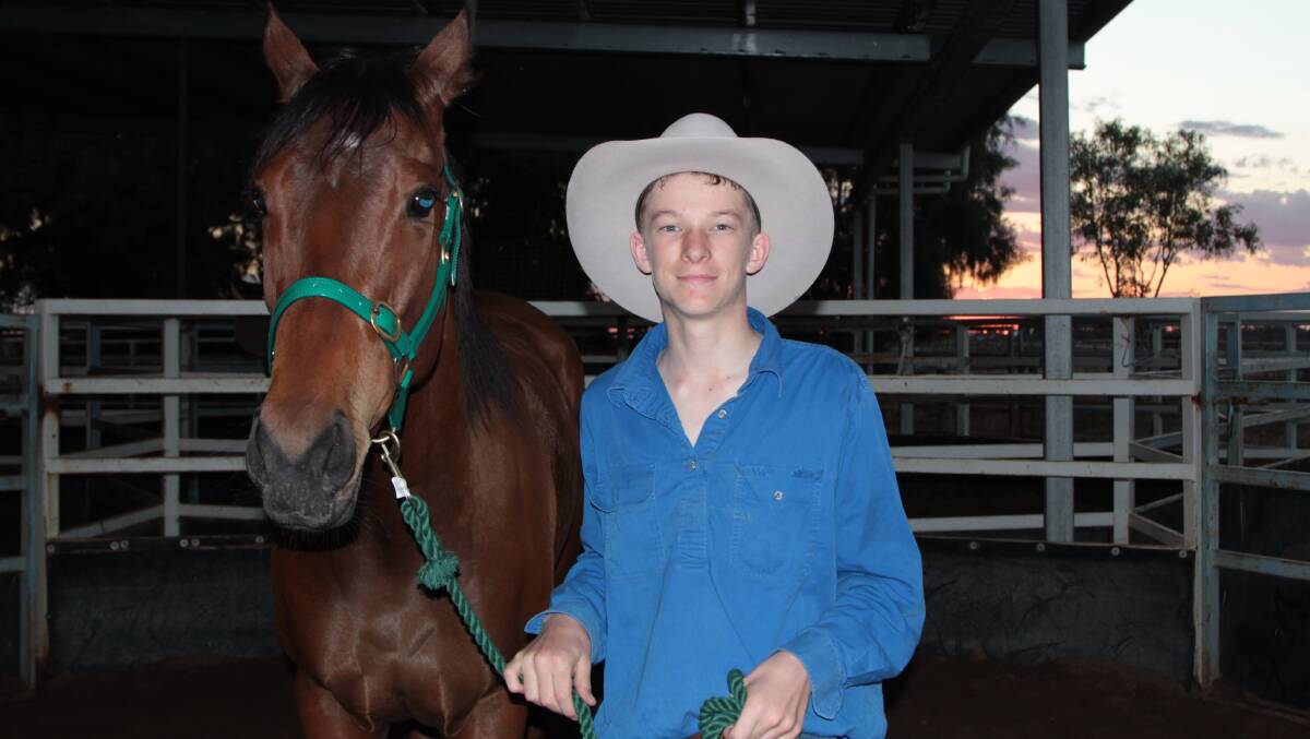 Generosity plus: Isisford's Ben Spackman lost no time in getting acquainted with his new horse, Limerick Star, donated by Brisbane's Ron Cameron.