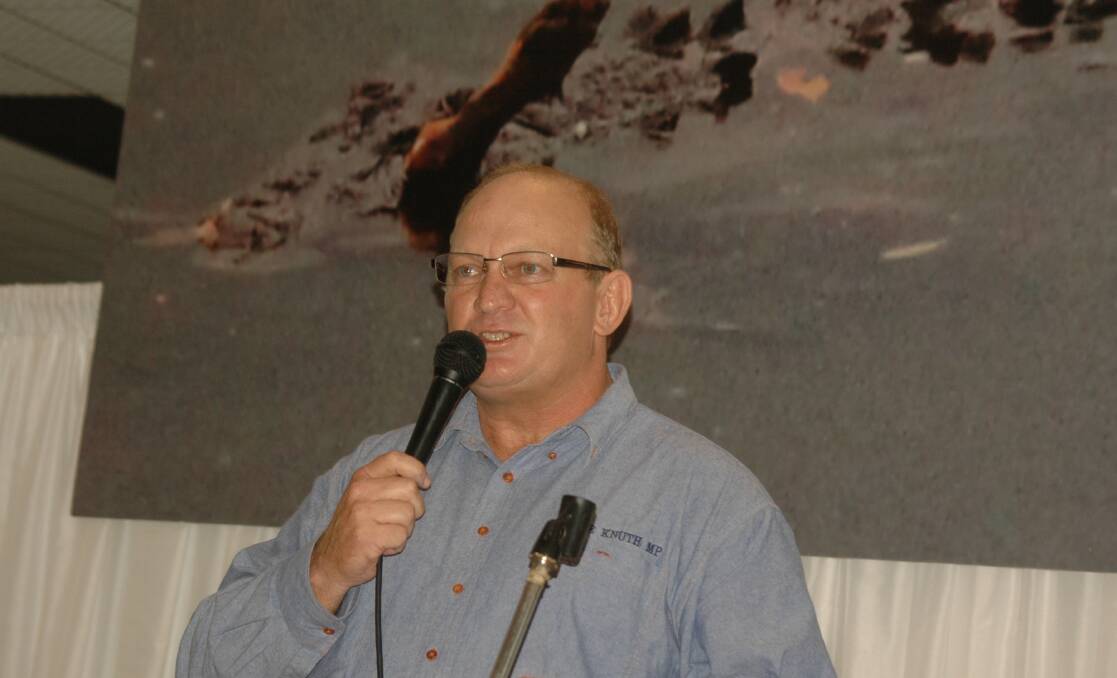 Set against a three metre backdrop of a crocodile with a kelpie in its mouth, taken near Innisfail last week, Shane Knuth addressed gatherings in Mareeba, Innisfail and Port Douglas. Photo supplied.