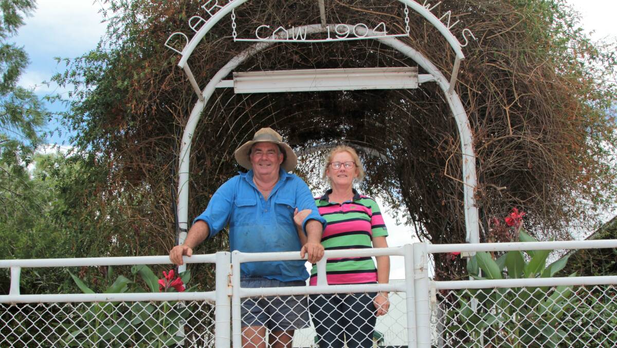 Cam and Sharon Tindall at the entrance to the Darr River Downs homestead, and the distinctive archway entrance featuring the property brand.