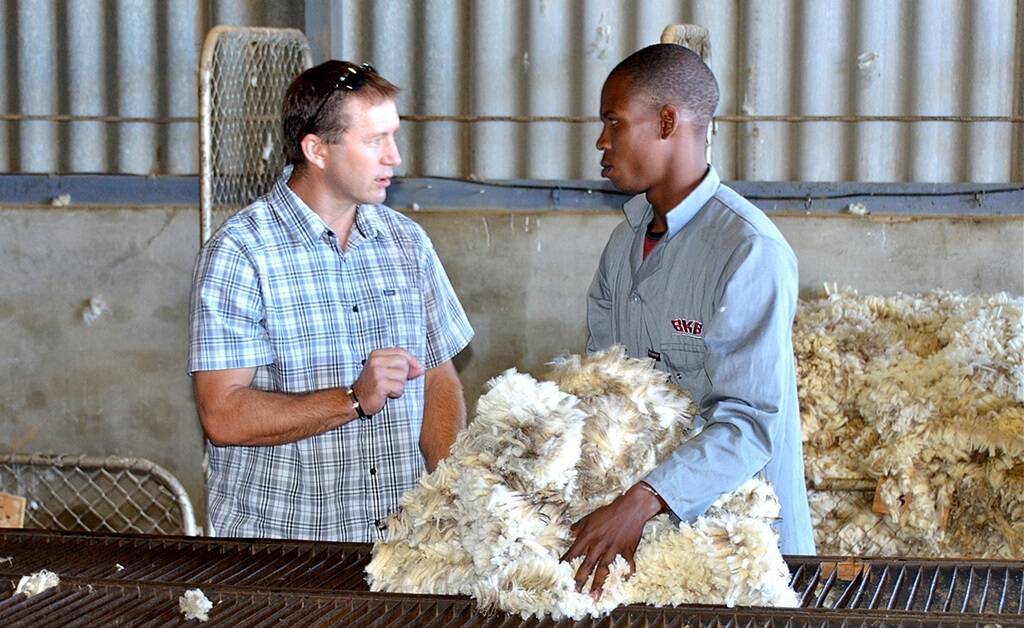 Primaries wool technician Greg Tilbrook chatting to a BKB classer on a farm in the Eastern Cape in South Africa in 2014.