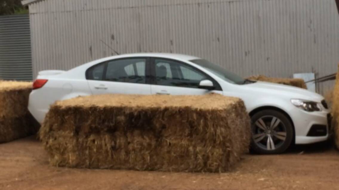 The now infamous car used by receivers that was blocked in by straw bales on Bruce Dixon's farm last year.