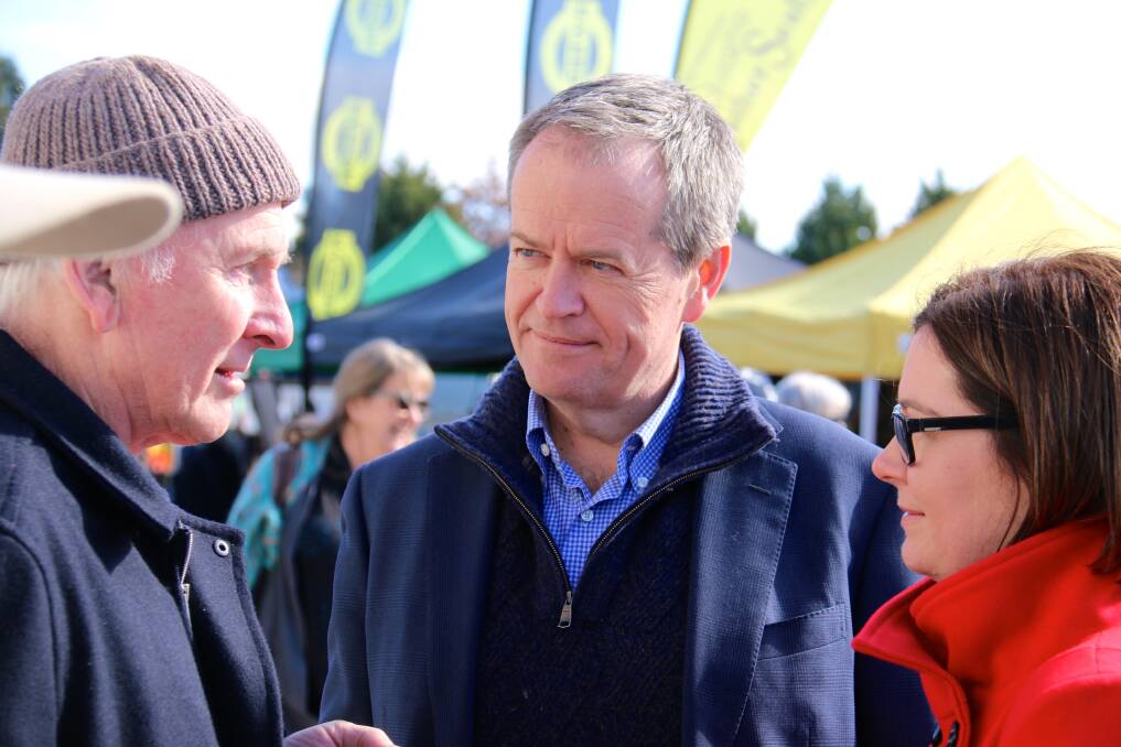 Labor leader Bill Shorten (centre) with Bendigo Labor MP Lisa Chesters listening to feedback, at the Bendigo wool and sheep show.