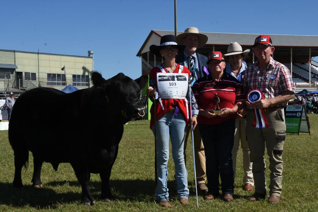Handler Amber McLucas, Ipswich holds grand champion Australian Heritage Angus bull Mason Farm Monte Majura with owners Tracey and Greg Krahenbring, Mason Farm Australian Heritage Angus, Talgai holding the ribbons and judge Graham Brown, Windera and associate judge Belinda Webber, Pittsworth. Picture by Ashley Walmsley