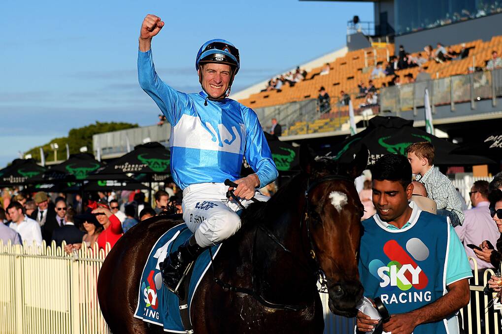 Jockey Blake Shinn gestures after riding Prompt Response to victory in the Tattersall's Club Tiara at Doomben Racecourse on Saturday. Picture - Albert Perez.