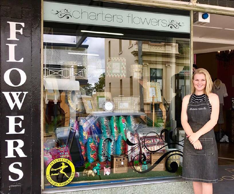 Katelyn O'Donoghue featured out the front of her shop front of Charters Flowers. Photo supplied.