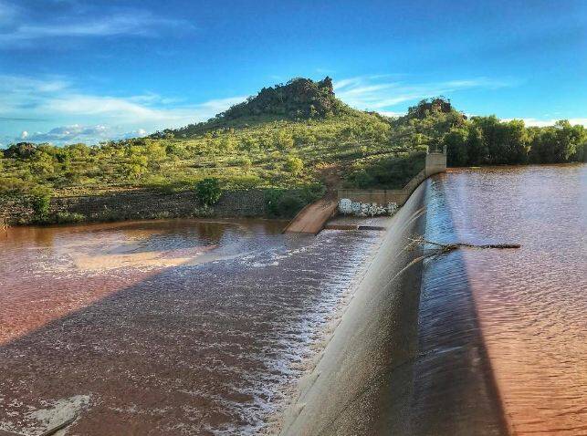MOIST: Chinaman Dam at Cloncurry spilled over the spillway yesterday after receiving much needed rain. Photo on instagram by: Warren Weller